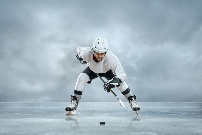 Man in hockey uniform on ice
