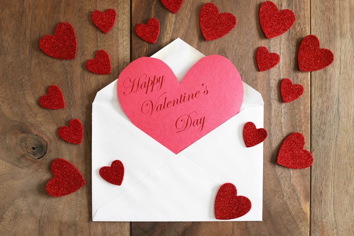 Valentine's Day card with hearts on wood