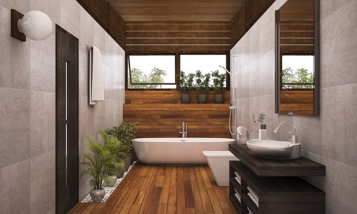 Modern bathroom with bathtub, sink, and wooden accents