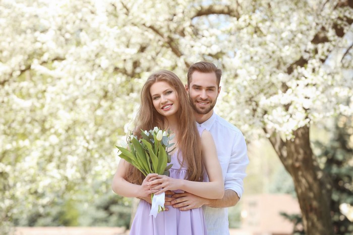 Couple with Tulips in a Blooming Garden