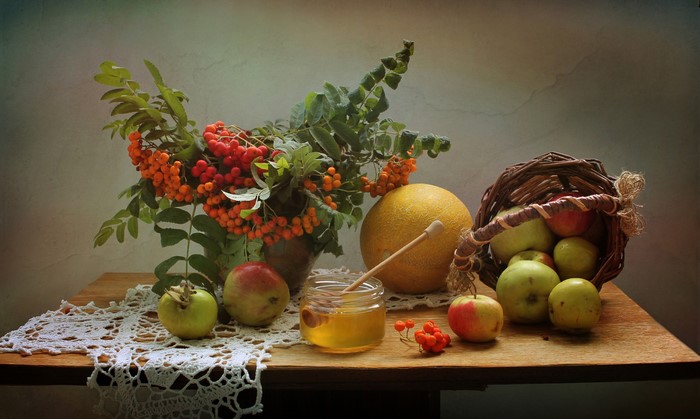 Still life with apples, sorbus, melon, and honey