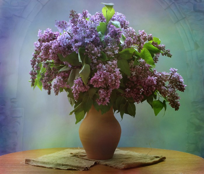 Bouquet of lilacs in a vase on a table