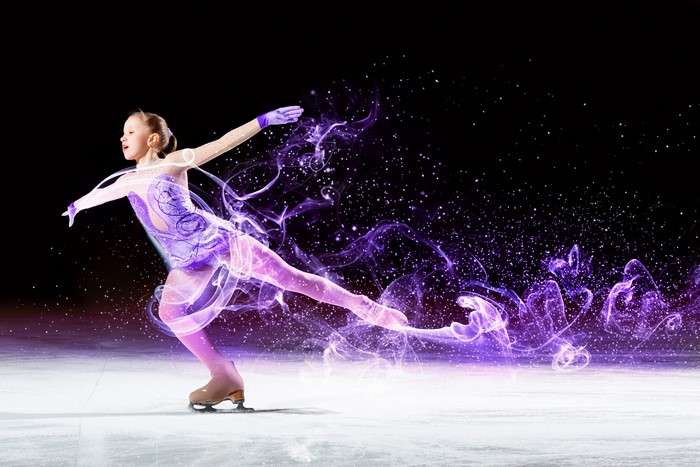 Girl ice skating with purple smoke and sparkles