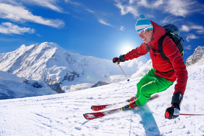 Man skiing down a snowy mountain
