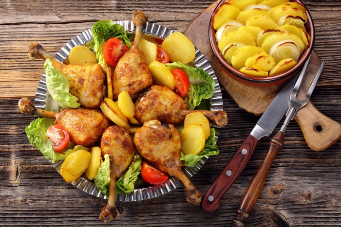 Roast Chicken and Potatoes with Knife and Fork