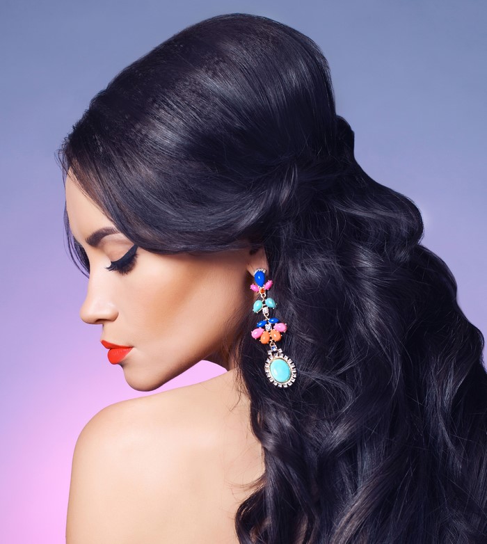 Brunette woman with colorful earrings