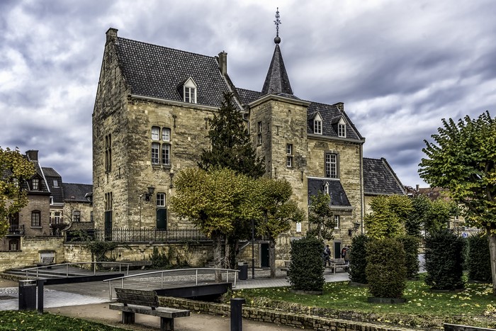 Castle in Valkenburg, Netherlands with bridge and bench