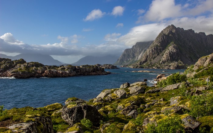 Rocky coast with mountains and sea in Norway