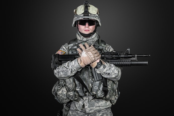 Soldier with Assault Rifle on Black Background