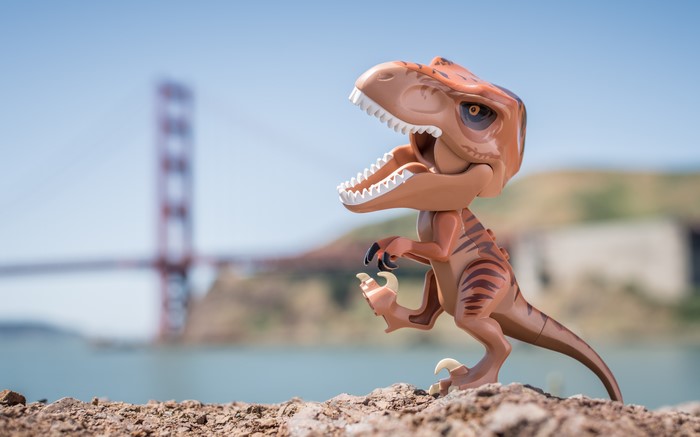 Tyrannosaurus Rex toy with Golden Gate Bridge