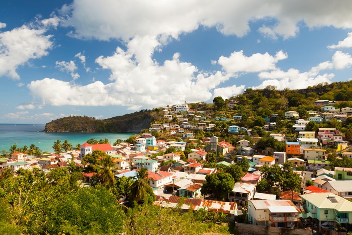 Colorful houses on a hillside overlooking the sea in Saint Lucia