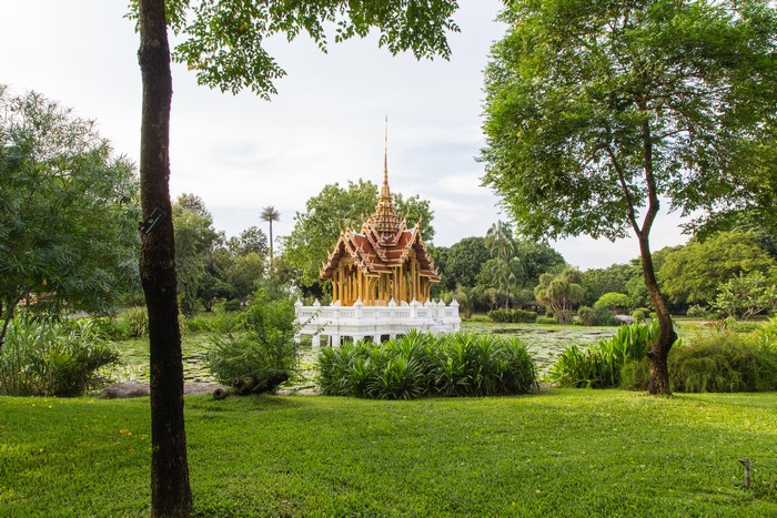 Golden pagoda in a tropical garden park in Thailand