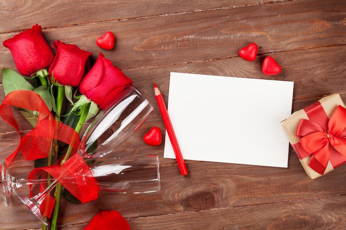 Valentine's Day Roses, Champagne Glasses, Gift, and Note on Wood