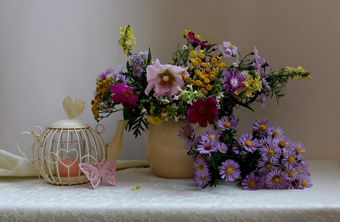 Still-life with bouquet of flowers, kettle, and butterflies