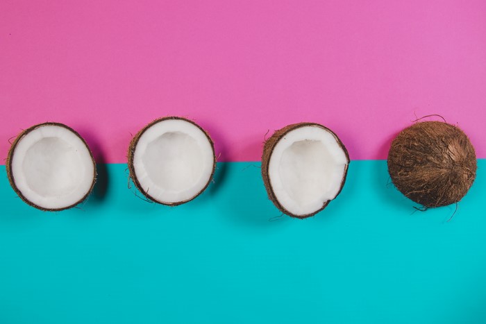 Coconuts on pink and turquoise background
