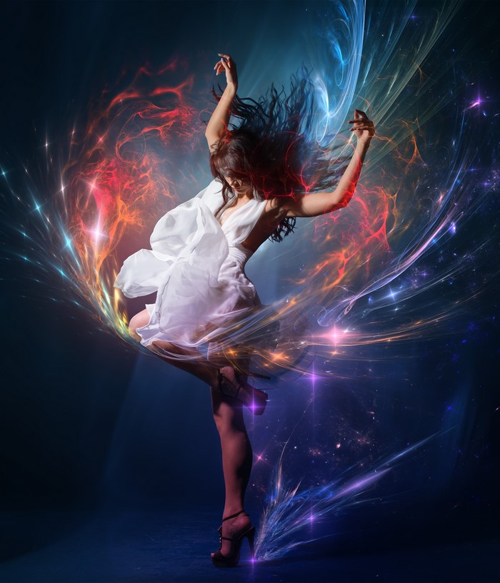 Woman in white dress dancing with colorful energy