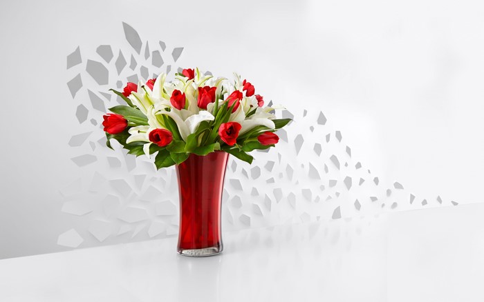 Red vase with tulips and lilies