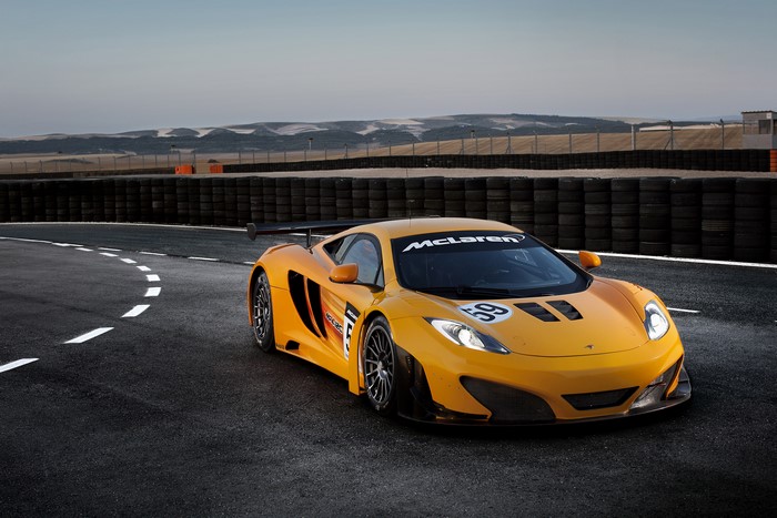 Orange McLaren 2011 MP4-12C GT3 on Race Track