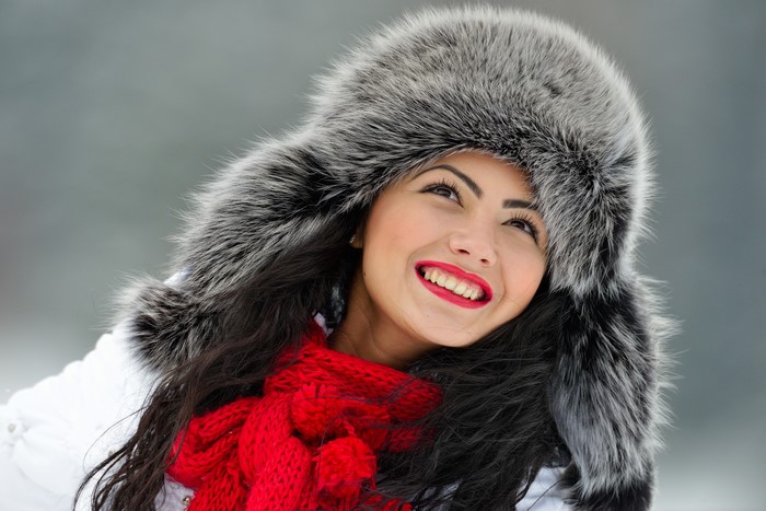 Woman in Winter Hat and Scarf Smiling