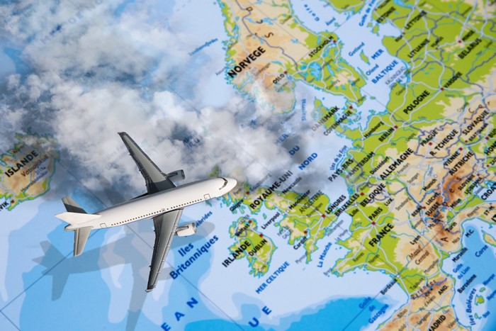 Airplane flying over Europe map
