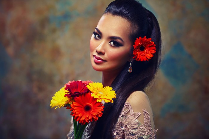 Brunette girl with gerberas