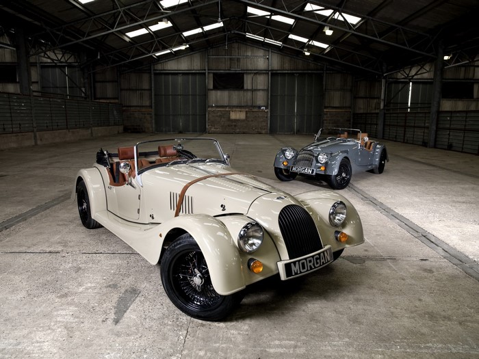 Two Morgan Roadsters in a Warehouse