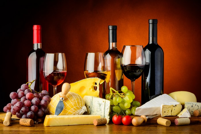 Still-life of wine, cheese, and grapes