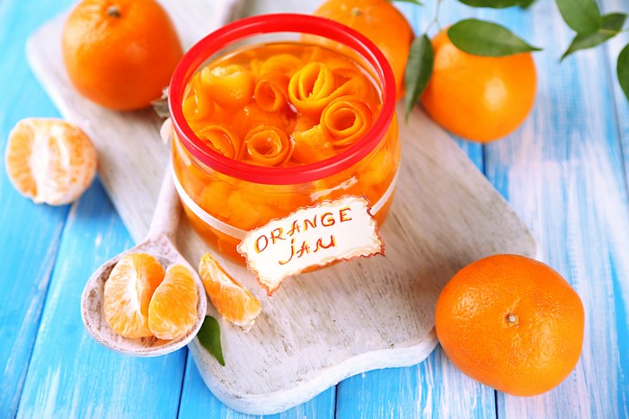 Orange Jam in a Jar with Oranges