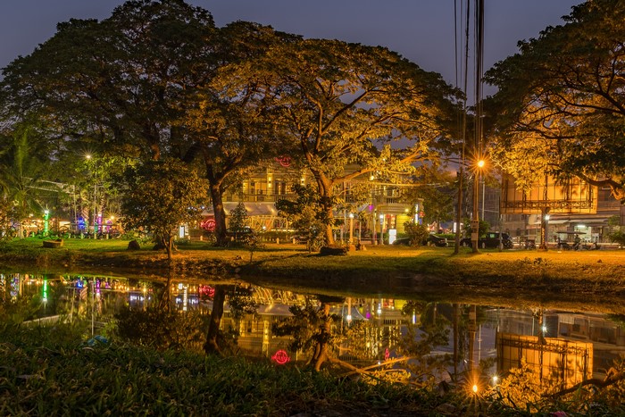 Hard Rock Cafe Park Cambodia at dusk with pond reflection