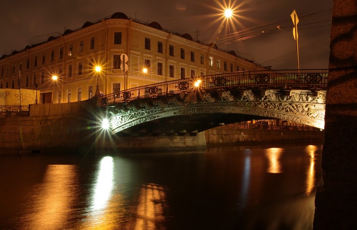 Bridge over canal at night in St. Petersburg, Russia