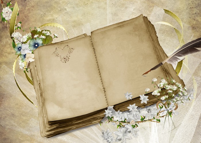 Open notebook with quill and flowers