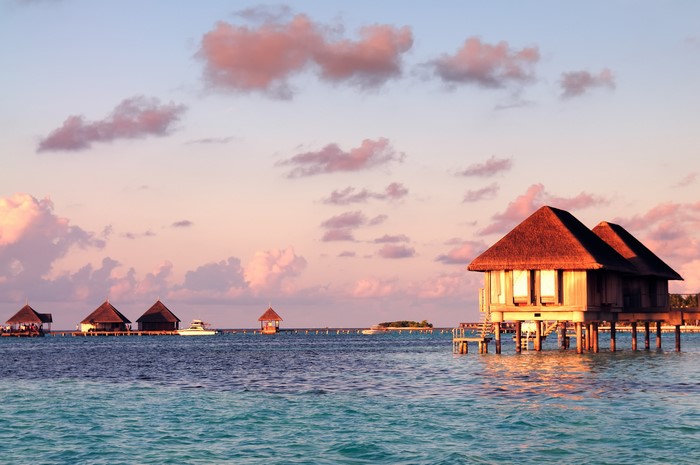 Overwater bungalows in the Maldives at sunset