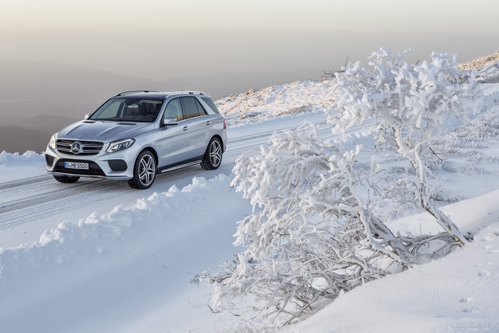 Silver Mercedes-Benz GLE 500 driving in snow