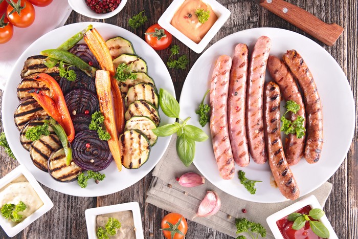 Grilled Vegetables and Sausages on Plates