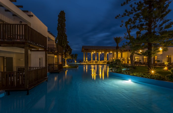 Resort in Rhodos, Greece at dusk with pool and restaurant