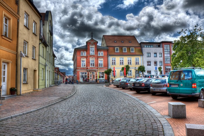 Street scene in Barth, Germany with parked cars and buildings