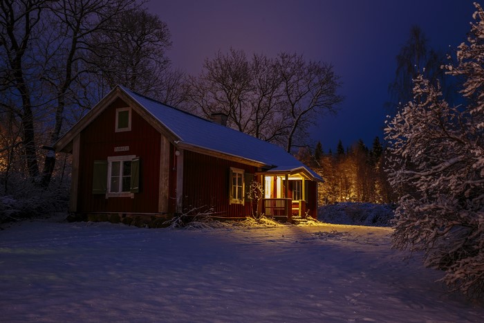 Red house in Sweden during winter evening