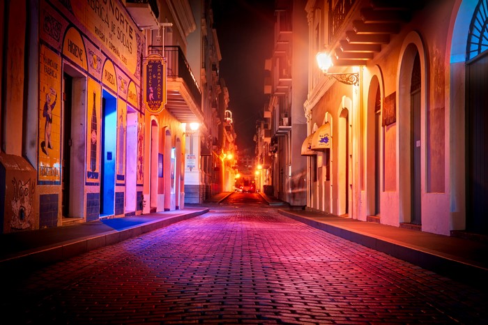 Night street in San Juan, Puerto Rico with cobblestone road