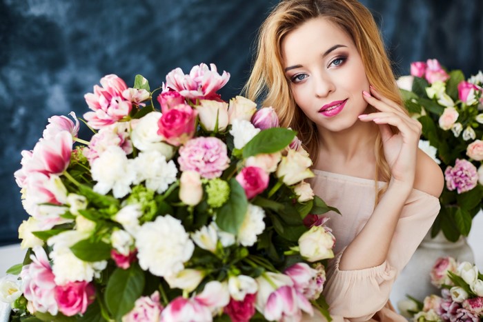 Blonde girl with bouquets