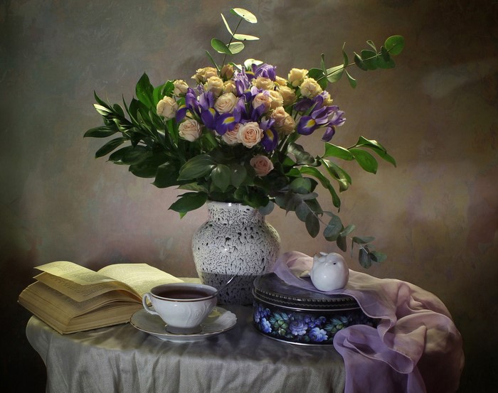 Still-life with bouquet, book, and tea