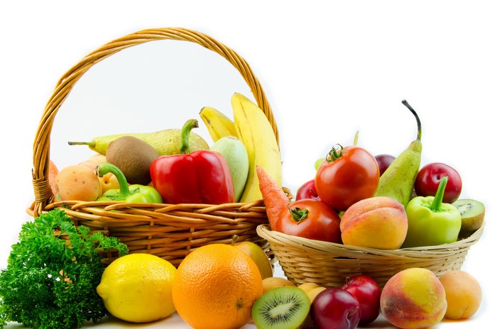 Assortment of fruits and vegetables in wicker baskets
