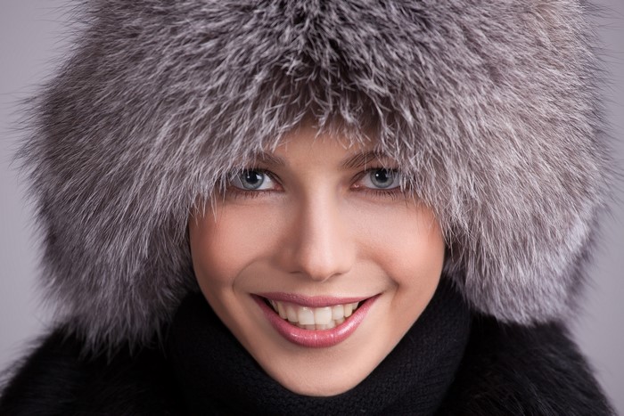 Woman in a fur winter hat and scarf