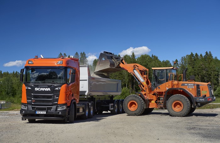 Scania truck and Doosan loader at work