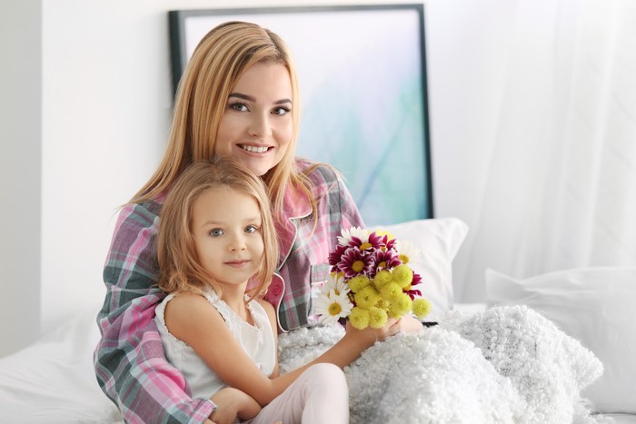 Mother and daughter with flowers