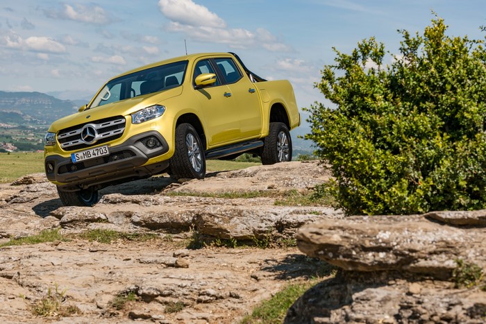 Yellow Mercedes-Benz X-Klasse Pickup Truck on Rocks