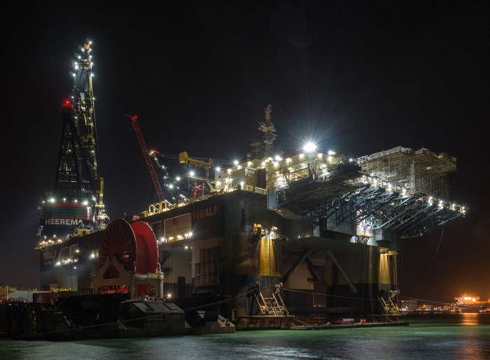 Heerema Thialf crane vessel at night in Caland Canal