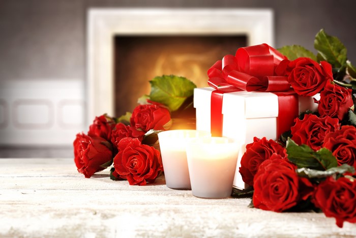 Red Roses, Gift, and Candles by Fireplace