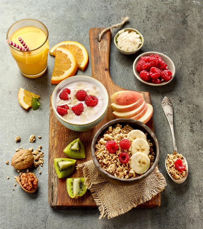Healthy Breakfast with Juice, Muesli, and Fruits