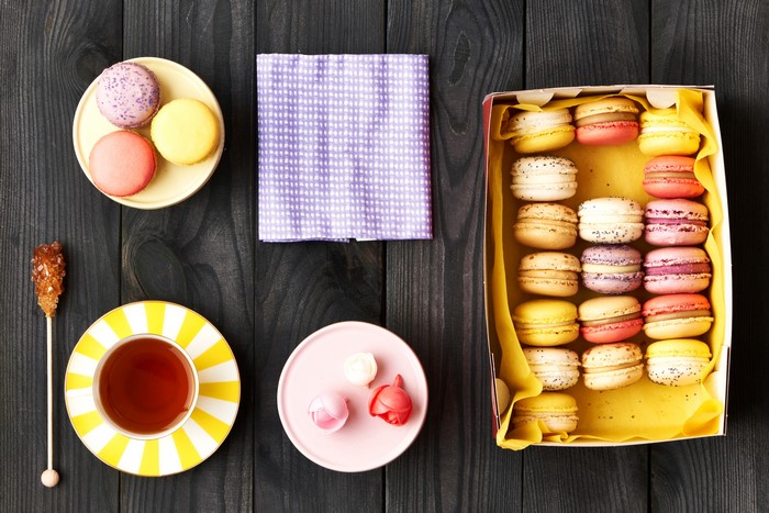 Tea and Macarons on a Wooden Table