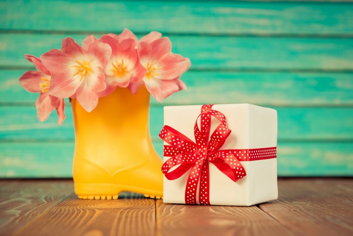 Tulips in a yellow boot with a gift